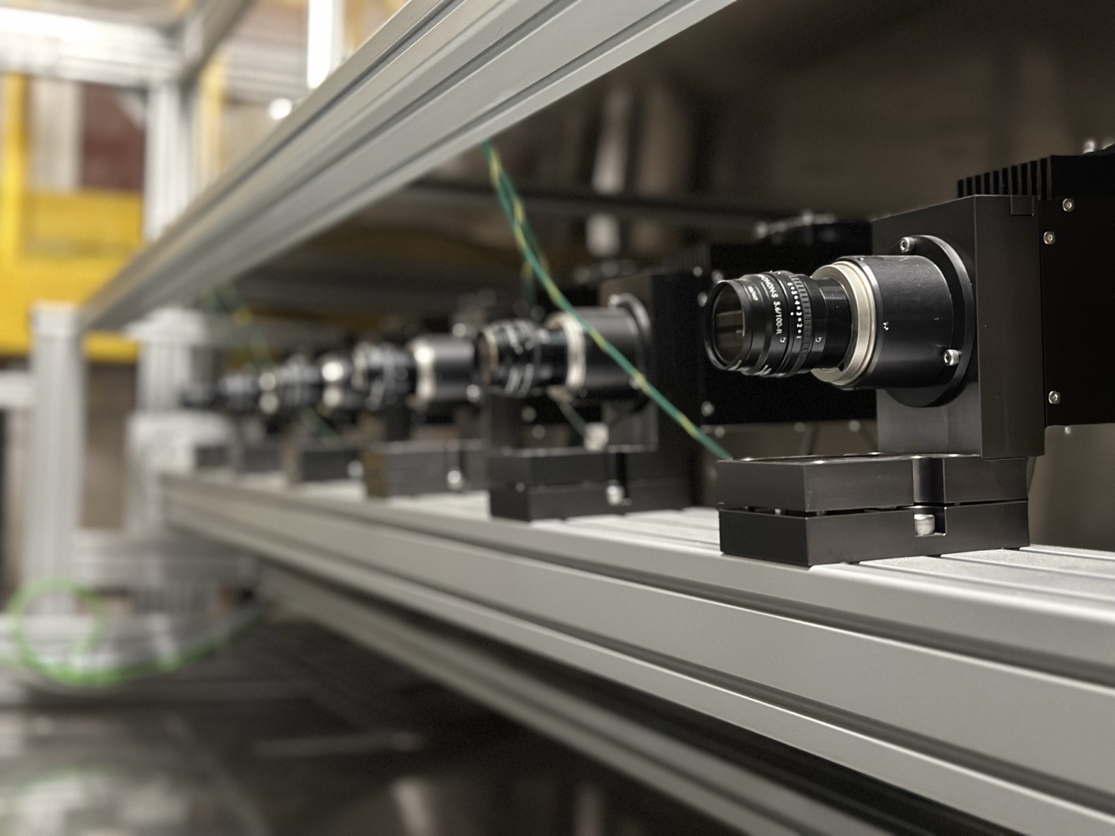 Vision inspection system mounted over a wide converting line